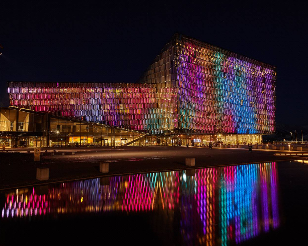 Harpa concert hall lights up in the dark